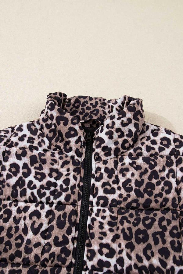 Close-up of collar and zipper on Leopard Print Quilted Puffer Gilet. Features high neck and bold leopard pattern for trendy outerwear.