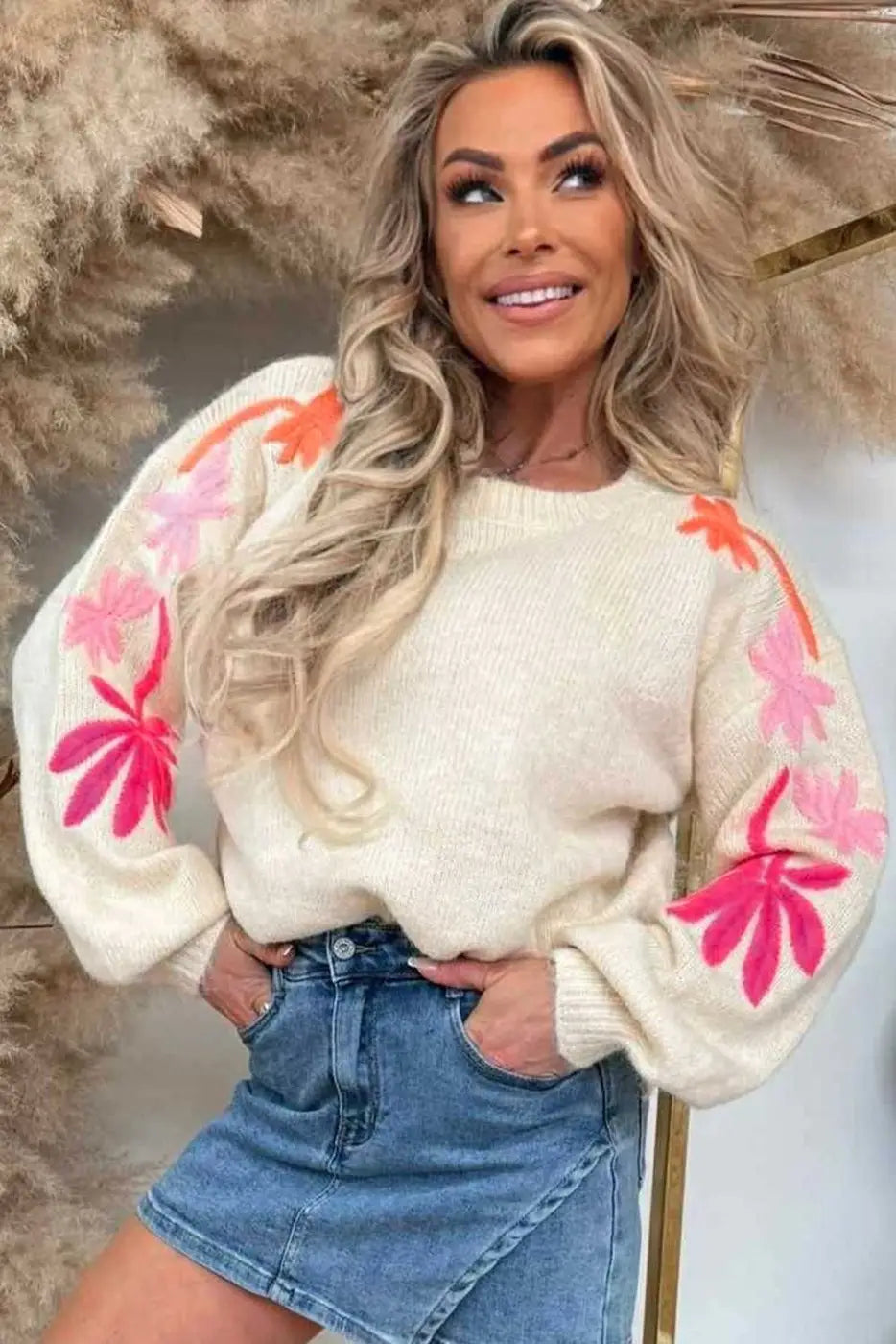 Front view of cream Floral Embroidered Sleeve Jumper for women, showcasing colorful floral sleeves and cozy knit texture.
