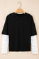 Front view of the Lace Sleeve Drop T-Shirt - Soft & Comfy | FashionFitz, featuring black body and white floral lace long sleeves on hanger.
