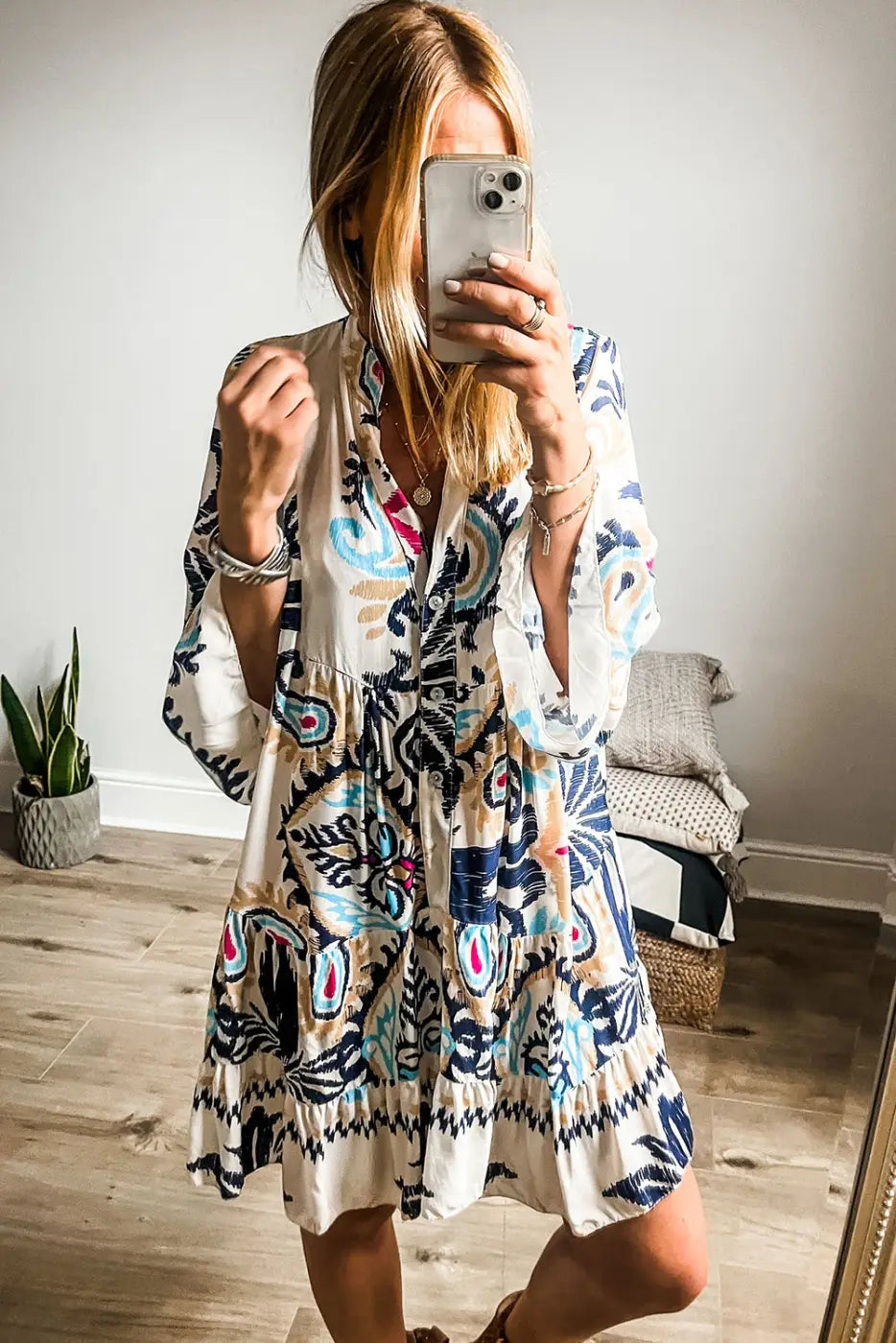 Front close-up of the Bohemian Tribal Mini Dress with bracelet sleeves, highlighting the buttoned neckline and flowy fit.