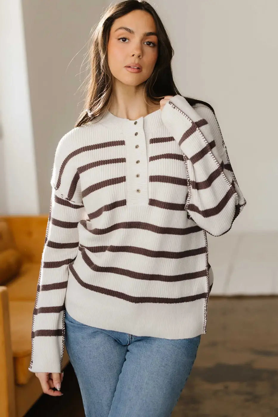 Model wearing casual slouchy striped Henley jumper with jeans, showcasing relaxed fit and soft knit for daily wear.