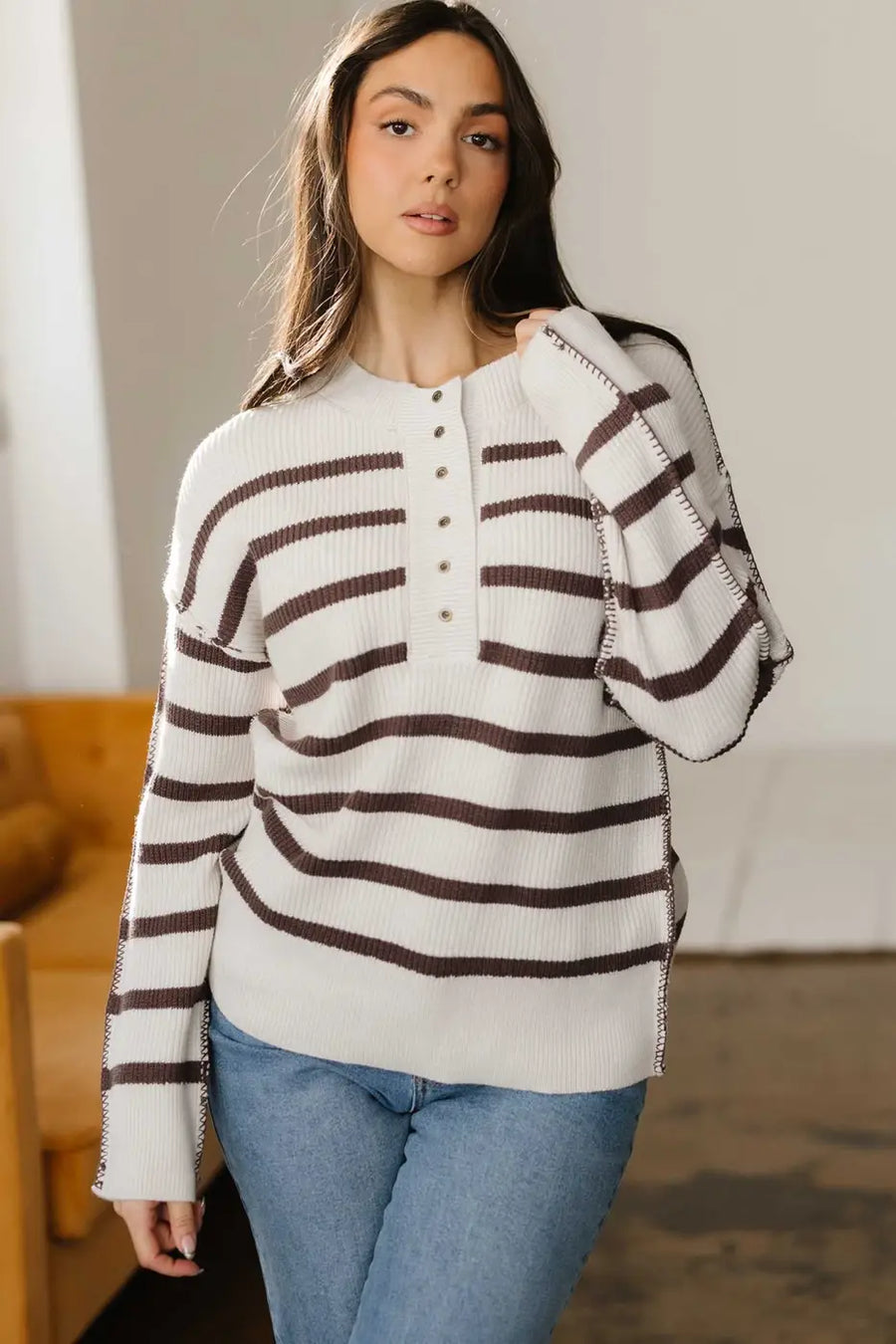 Model wearing casual slouchy striped Henley jumper with jeans, showcasing relaxed fit and soft knit for daily wear.
