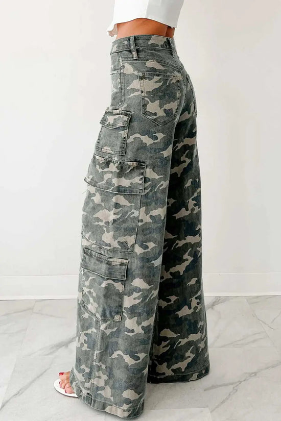 Side angle of camo cargo jeans women in green camo print with wide leg design and utility pockets. Casual high-waist denim pants for daily wear.