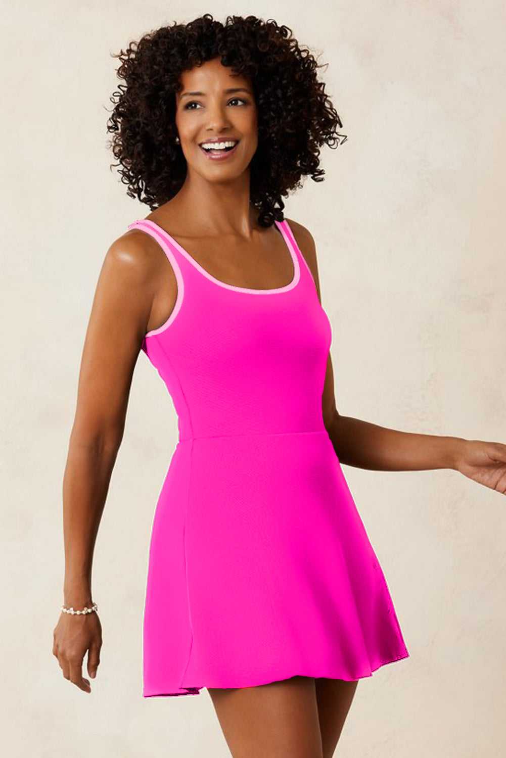 Front view of pink modest swim dress with shorts, high-waist fit and wire-free padded bust. Perfect for summer poolside fashion.
