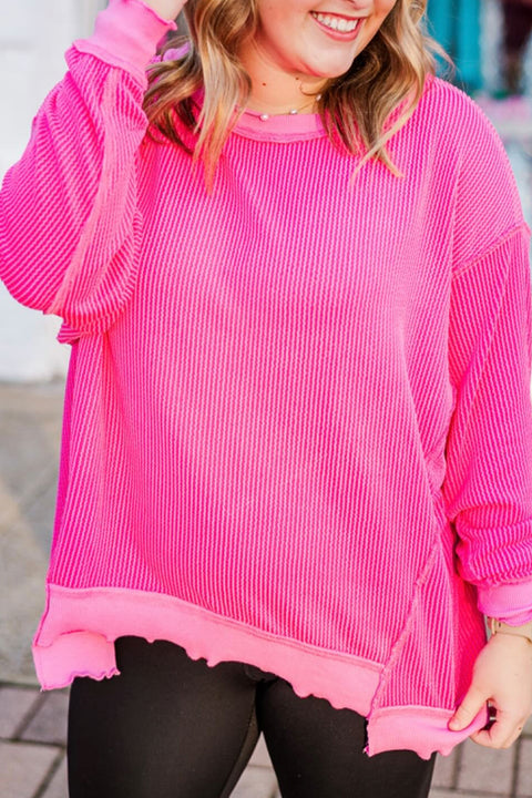 Woman wearing drop shoulder uneven hem plus size twisted rib top