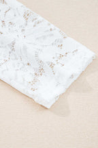 Detailed view of the white lace sleeve on the Lace Sleeve Drop T-Shirt - Soft & Comfy | FashionFitz, showcasing its floral lace pattern.