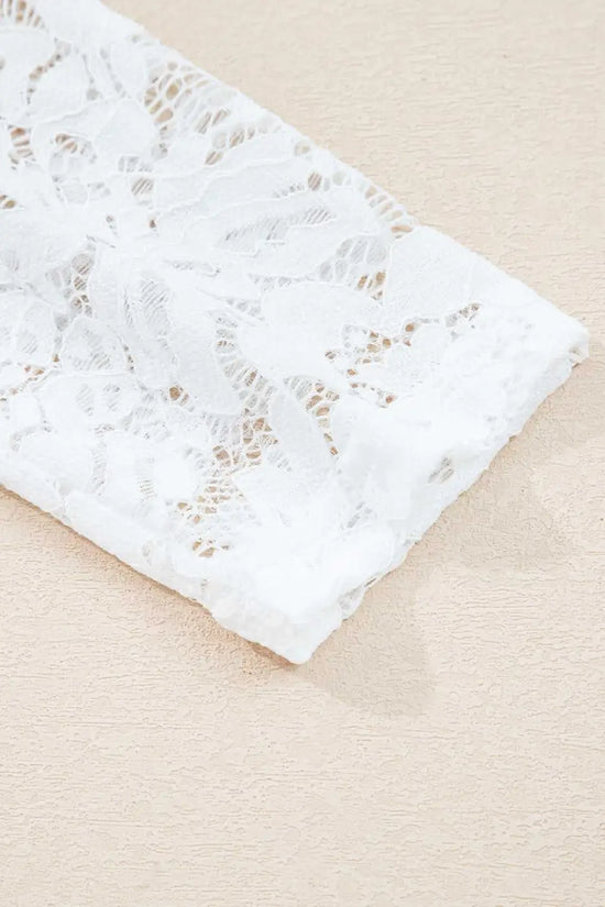 Detailed view of the white lace sleeve on the Lace Sleeve Drop T-Shirt - Soft & Comfy | FashionFitz, showcasing its floral lace pattern.