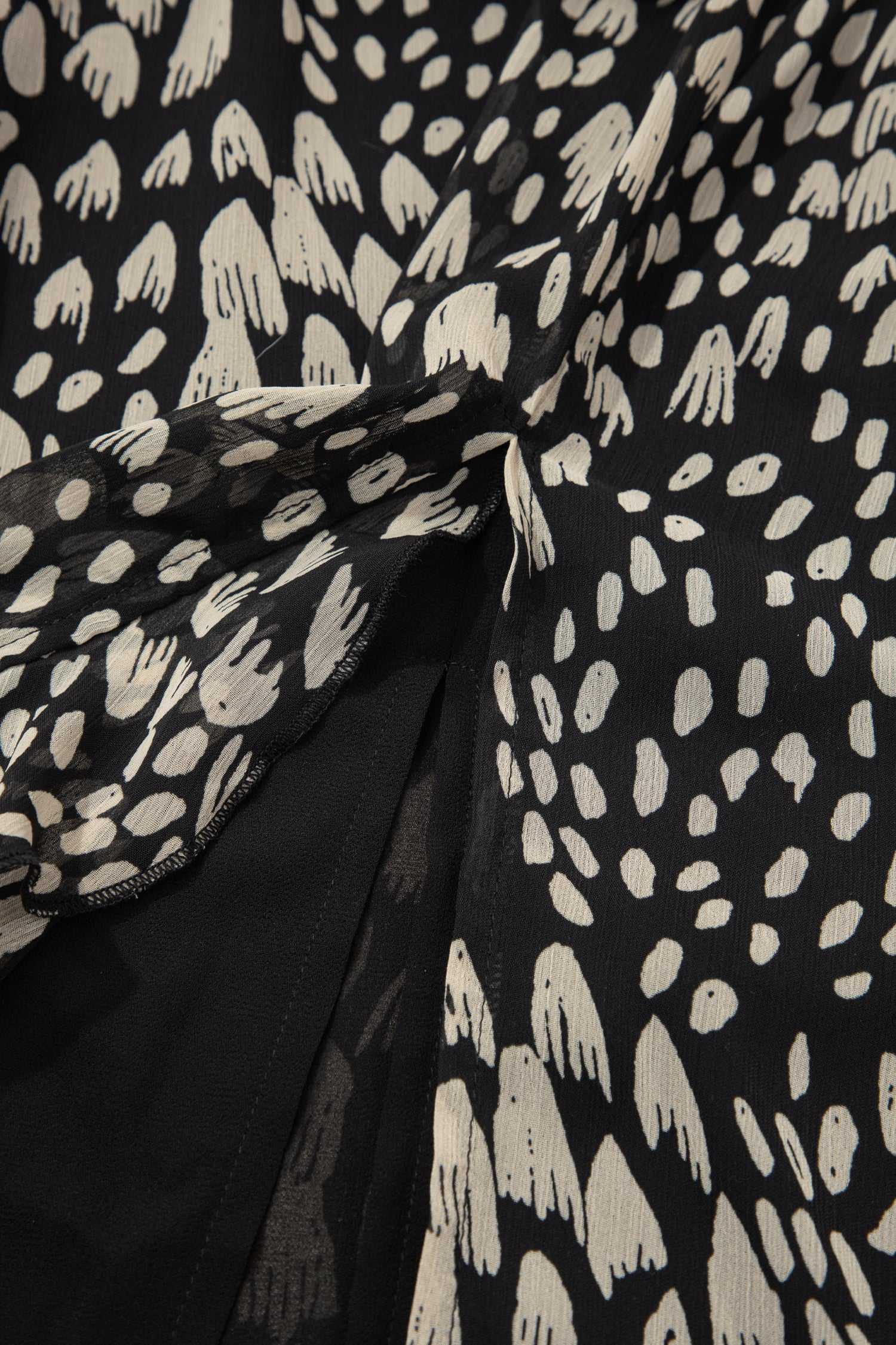 Detail of floral print and inner lining on Black Floral Sleeveless Maxi Dress showcasing lightweight, breathable fabric for summer.