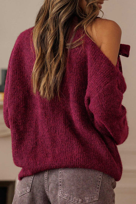 Back view of burgundy asymmetric off-shoulder sweater with relaxed fit. Soft knit fabric ideal for autumn layering and casual chic looks.