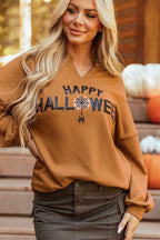Close-up of chestnut Sequin Halloween Graphic Top featuring sparkling 'Happy Halloween' text and spider web design on V-neck.