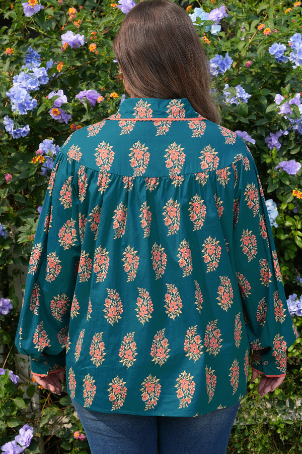 Back view of floral print loose plus size shirt with lacy trim