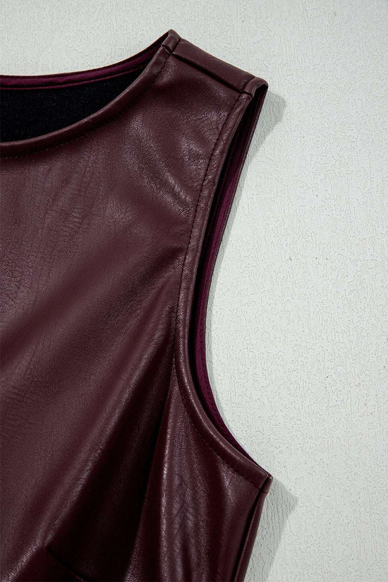 Close-up of armhole and shoulder seam on Brown Faux Leather Sleeveless Mini Dress, emphasizing craftsmanship and texture.
