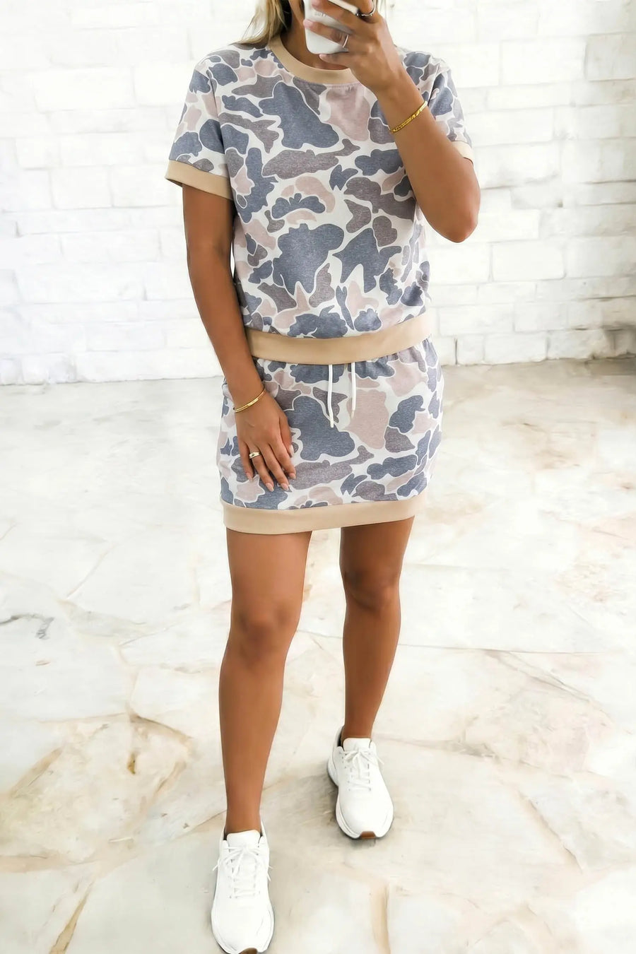 Camo skort set styled with chunky trainers — festival summer outfit