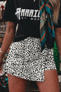 Woman wearing leopard print high waist button overlap denim shorts, front view, Fashionfitz UK