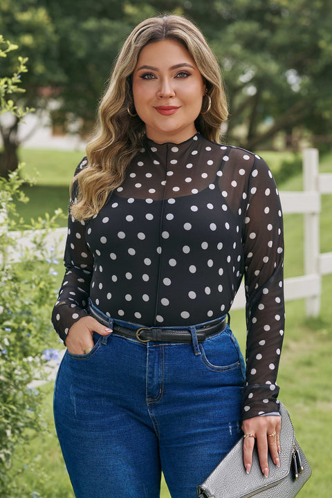 Woman wearing mock neck polka dot long sleeve mesh plus size top