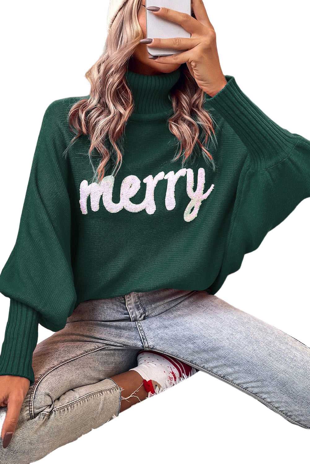 Isolated view of green Stylish High Neck Red Sweater - Christmas with 'merry' print, styled with jeans for a cheerful winter outfit.