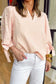 Model wearing the Bow Cuff Pearl Embellished Blouse tucked into white jeans, showing off its elegant and fun spring style.