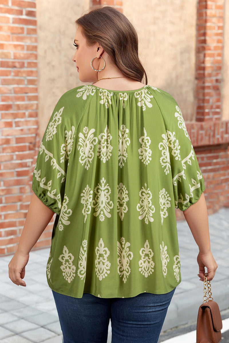 Back view of boho floral plus size blouse showing notched V neck detail
