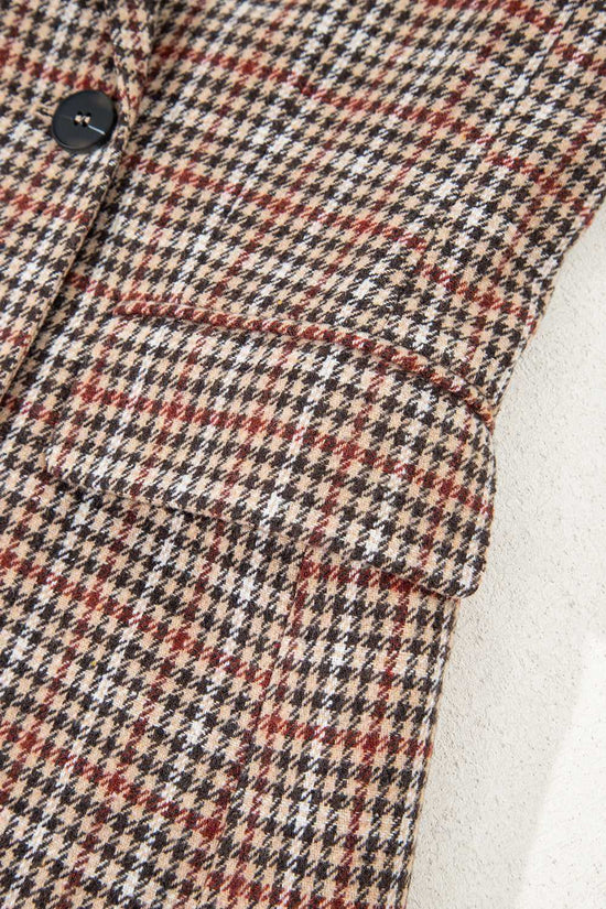 Close-up of front pocket and sleeve on Ladies Brown Houndstooth Fitted Blazer, highlighting structured tailoring and pattern.