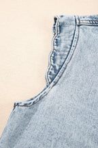 Detail of scalloped armhole trim on Beau Blue Denim Waistcoat, showcasing high-quality stitching and soft denim fabric.