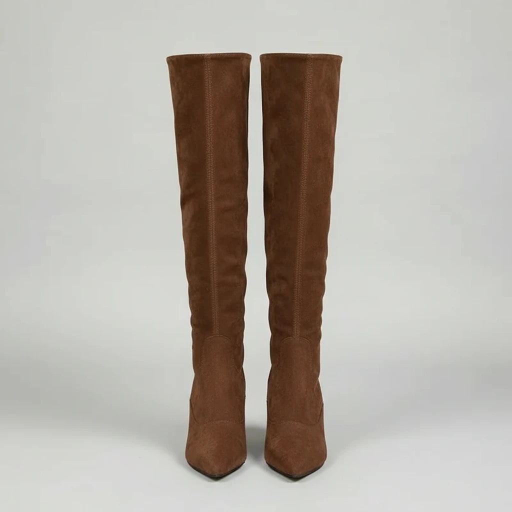 Brown retro suede knee-high boots with pointed toe and slim kitten heel, perfect for modern women’s fashion looks.