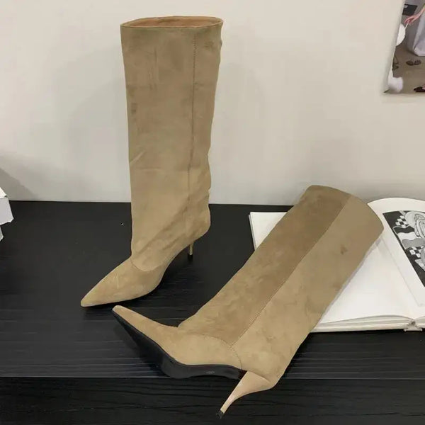Beige retro suede knee-high boots with pointed toe and kitten heel, ideal for chic women’s fashion styling.