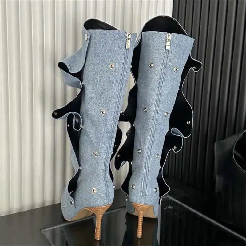 Back view of Women's Denim Boots with zippers, thin heels, and pleated design, showcasing silver button embellishments.