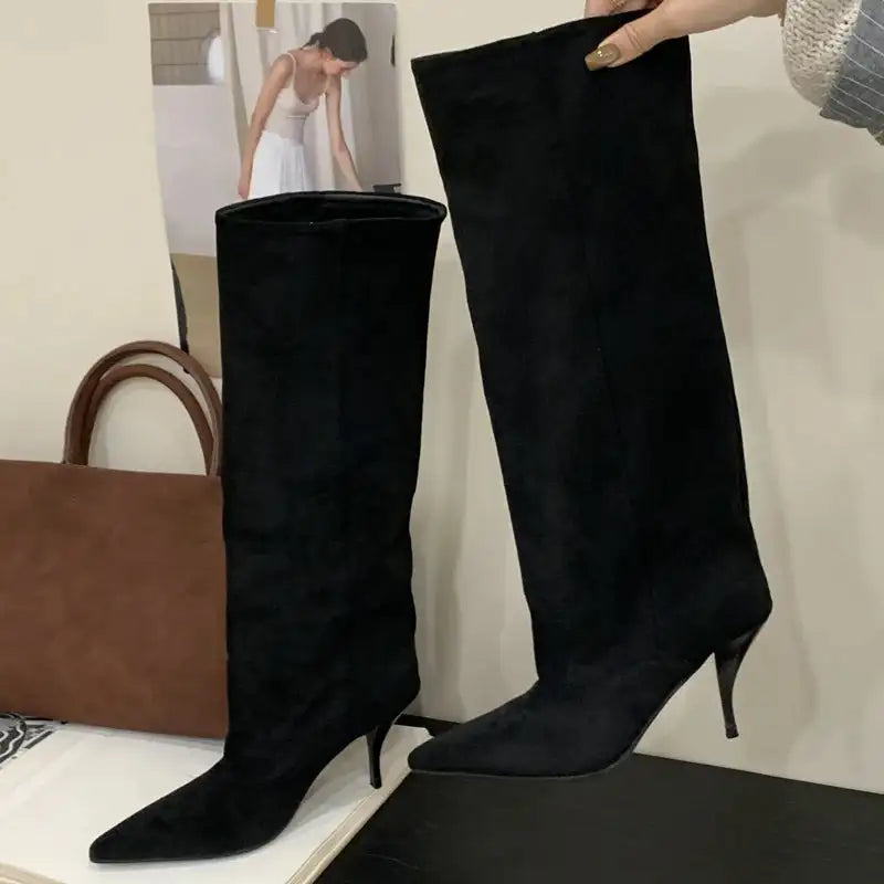 Chic black faux suede knee-high boots for women featuring a pointed toe and slim kitten heel for elegant styling.