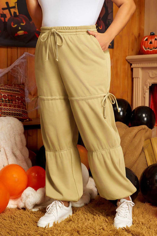 Side angle of Women's Terry Knit Drawstring Sweatpants in beige plus size, showcasing relaxed fit and drawstring accents for casual comfort.