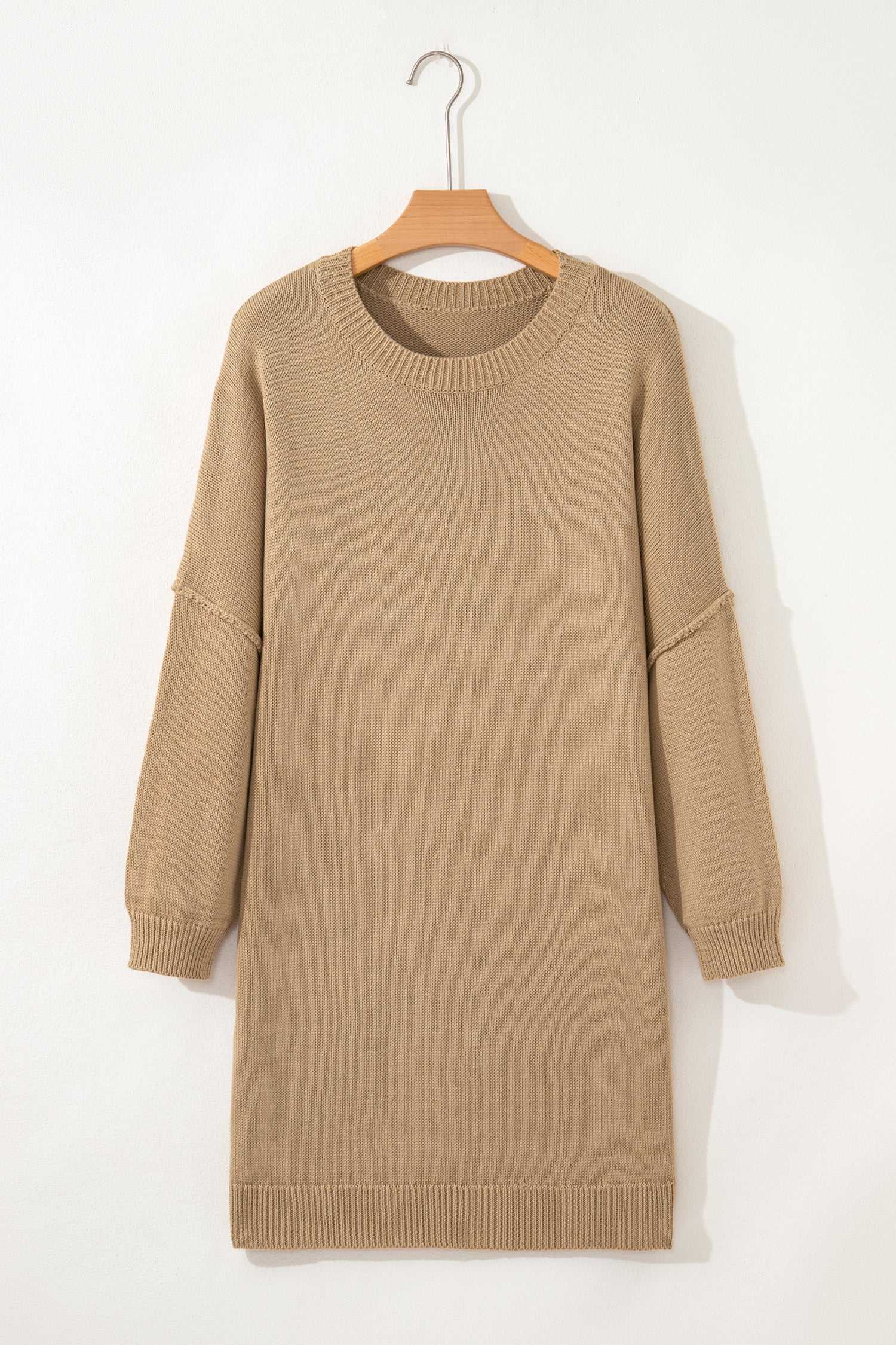 Khaki Oversized Jumper Dress on a hanger against a white background