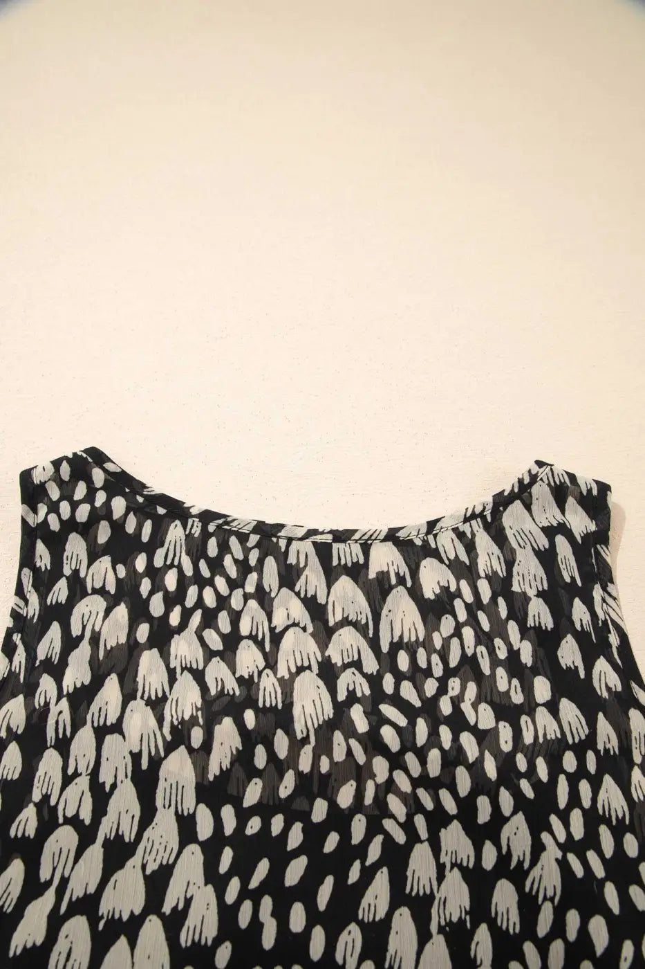 Back neckline detail of Black Floral Sleeveless Maxi Dress highlighting soft pleats and airy fabric for warm-weather comfort.