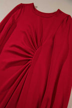 Close-up of the ruched waist design on the Red Long Sleeve Drape Midi Dress, emphasizing its flattering fit and detail.