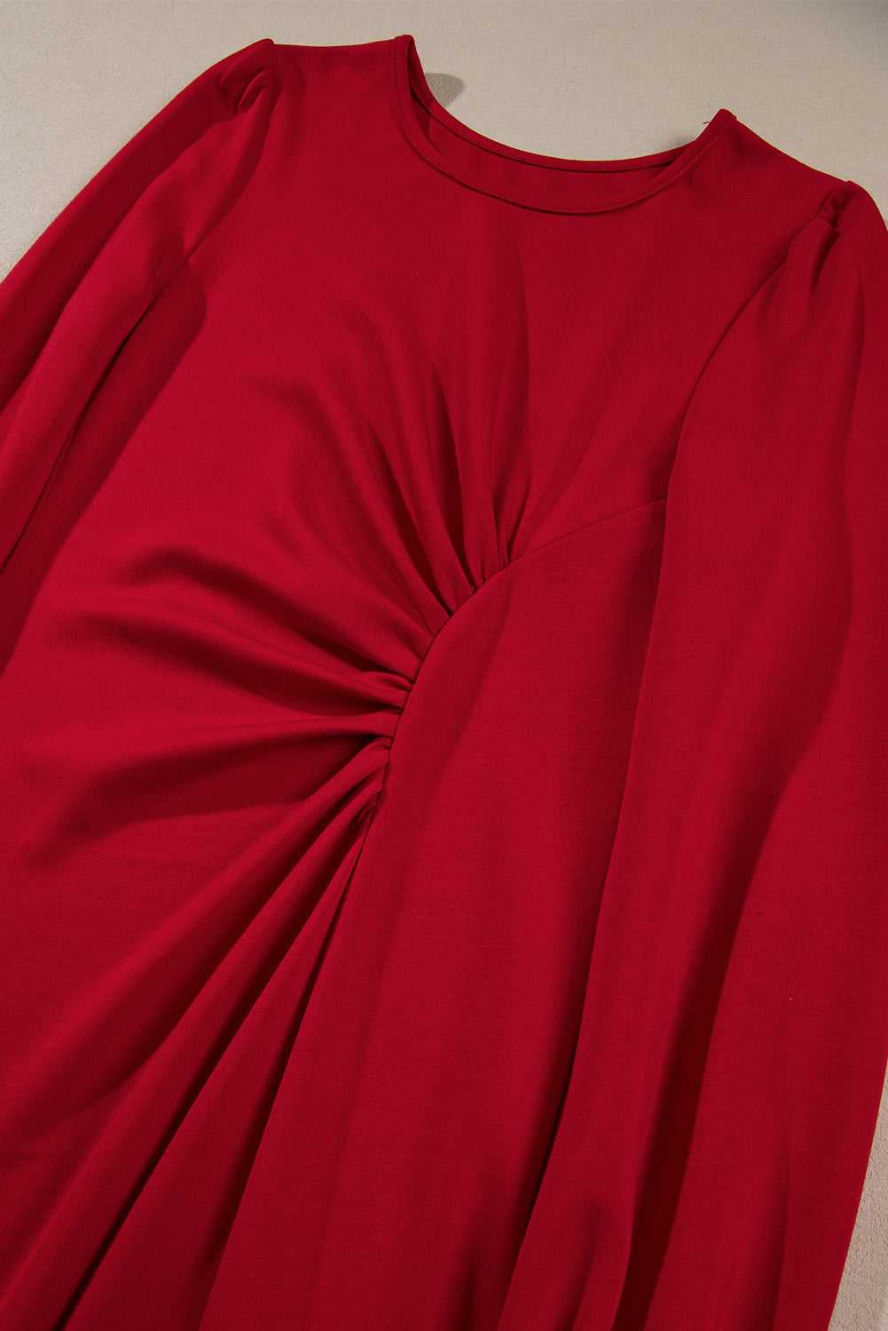 Close-up of the ruched waist design on the Red Long Sleeve Drape Midi Dress, emphasizing its flattering fit and detail.