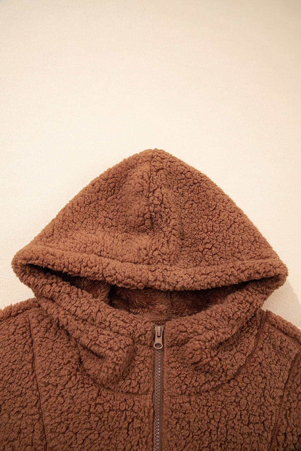 Detail of hood on Women's Zip‑Up Sherpa Hoodie Jacket, featuring thick sherpa fabric for added warmth and comfort.