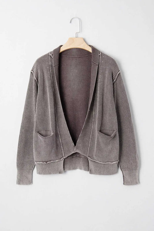 Brown stonewash patchwork knit open cardigan on hanger, showcasing longline silhouette and front pockets for casual wear.