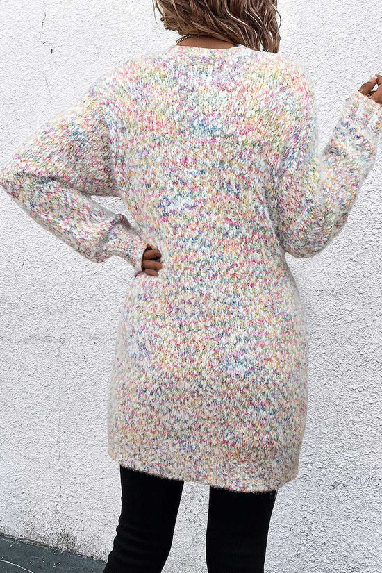 Back view of white duster long cardigan with colorful confetti knit pattern, showcasing relaxed fit and mid-thigh length.