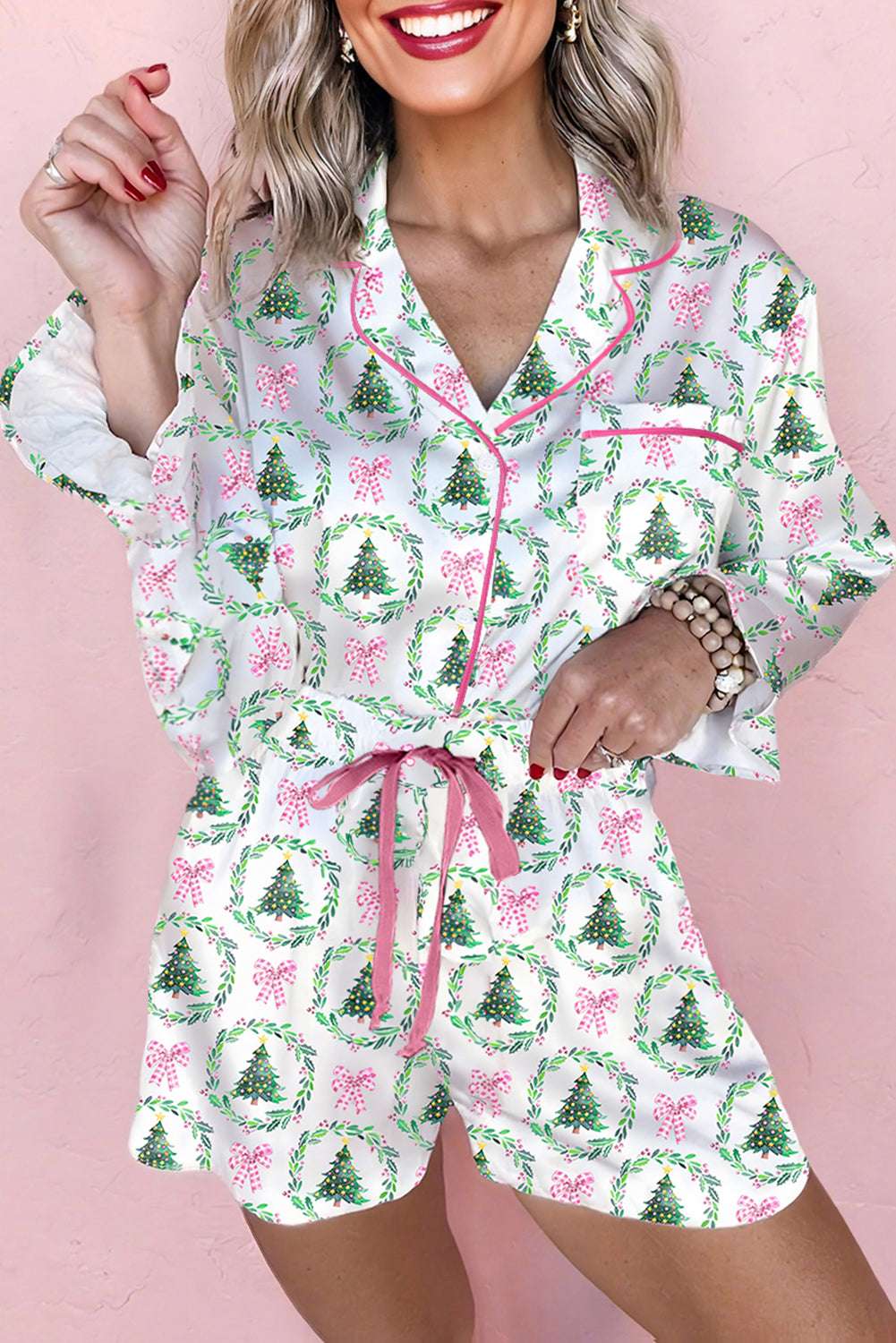 Ladies White Christmas Print Velvet Trim Pyjamas with pink bows and green wreaths, featuring pink velvet drawstring and piping detail.