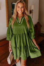 Green mini Stitch Detail Tiered V‑Neck Babydoll Dress by FashionFitz®, showcasing tiered skirt and Southern Belle style for autumn.