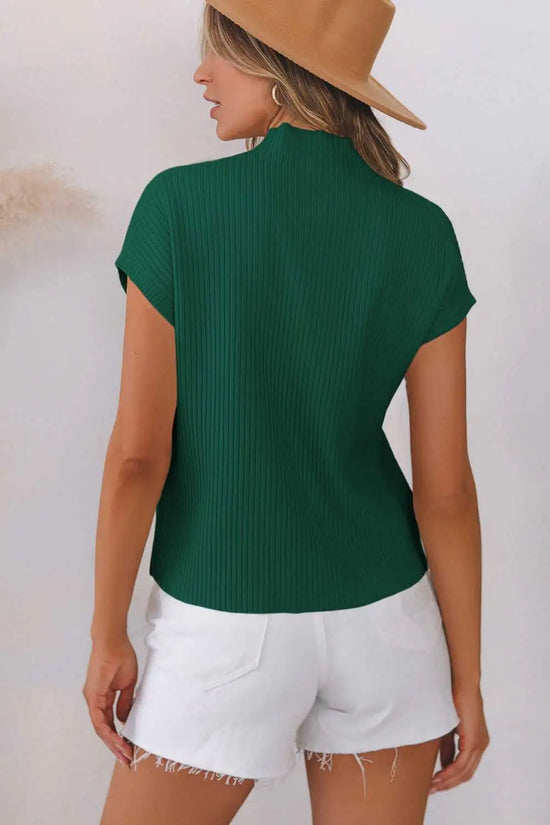 Back view of green Ribbed Knit Short Sleeve Sweater paired with white shorts, highlighting ribbed texture and casual fit.