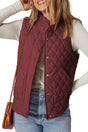 Flower‑Quilted Winter Gilet in burgundy with zip and snap buttons, styled with casual jeans and long-sleeve top for cozy winter layering.