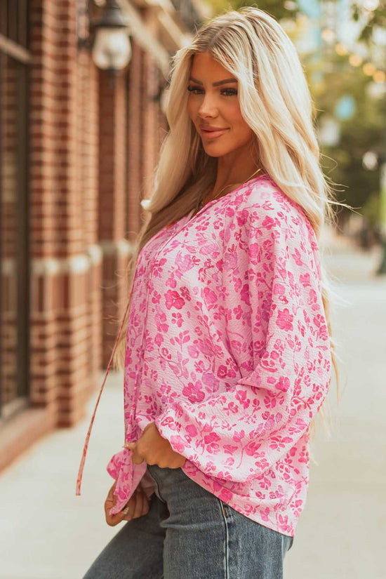 Side profile of Pink Floral Lightweight Blouse styled with jeans, highlighting its flowy silhouette and pink floral print.