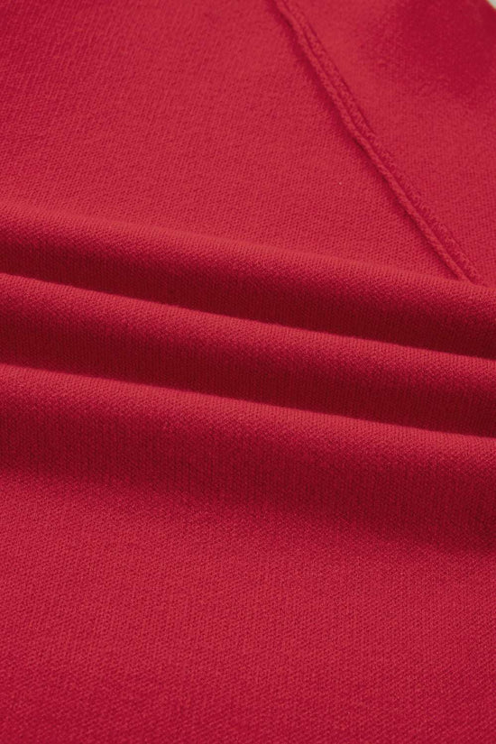 Close-up of the soft red fabric texture of the Women's Wrap Cardigan Jacket, highlighting its quality knit material.