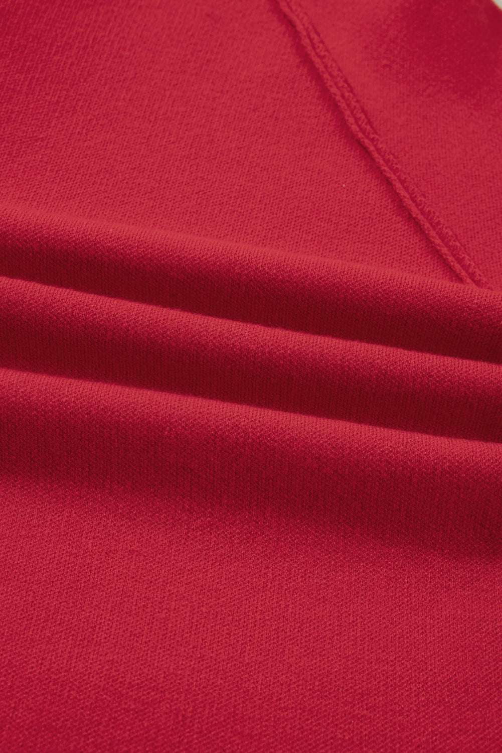 Close-up of the soft red fabric texture of the Women's Wrap Cardigan Jacket, highlighting its quality knit material.