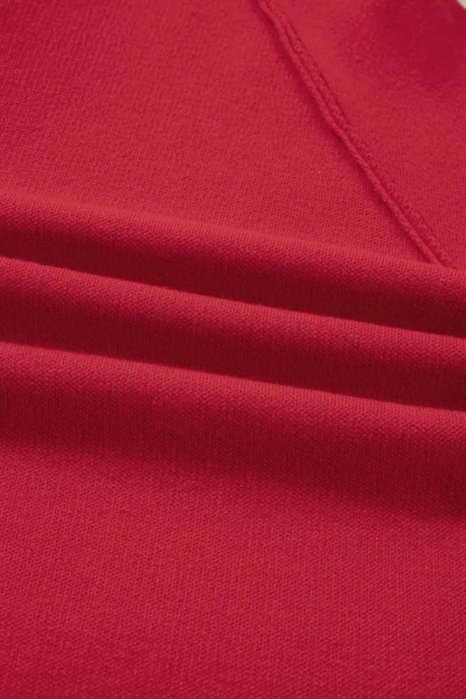 Close-up of the soft red fabric texture of the Women's Wrap Cardigan Jacket, highlighting its quality knit material.