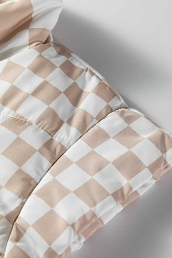 Detailed view of khaki plaid quilted fabric texture, emphasizing the soft, padded construction of this stylish winter vest.