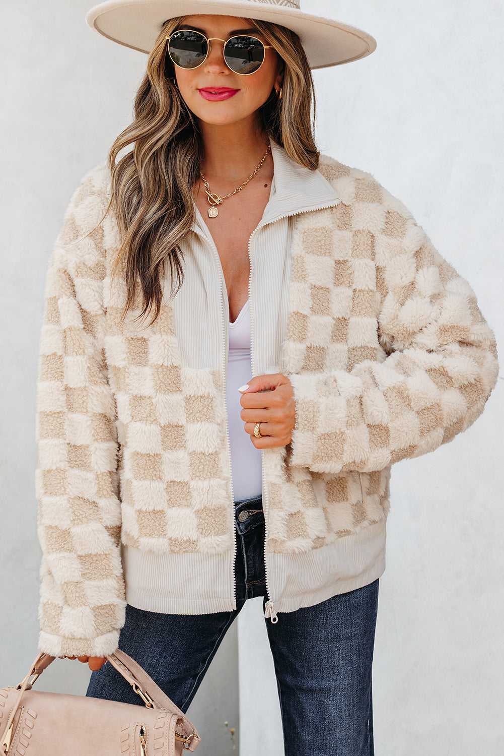 Woman wearing a Corduroy Sherpa Jacket with a plain background
