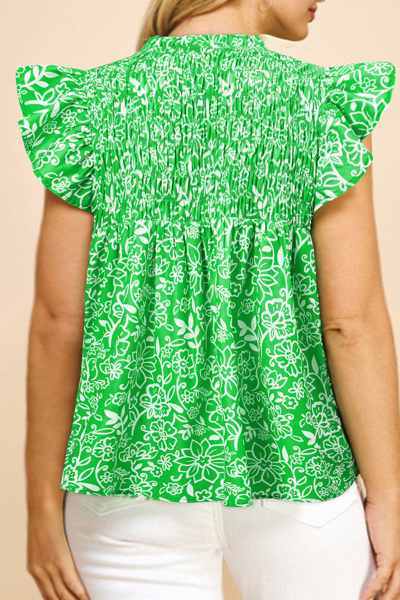 Back view of floral shirred plus size blouse with flutter sleeves