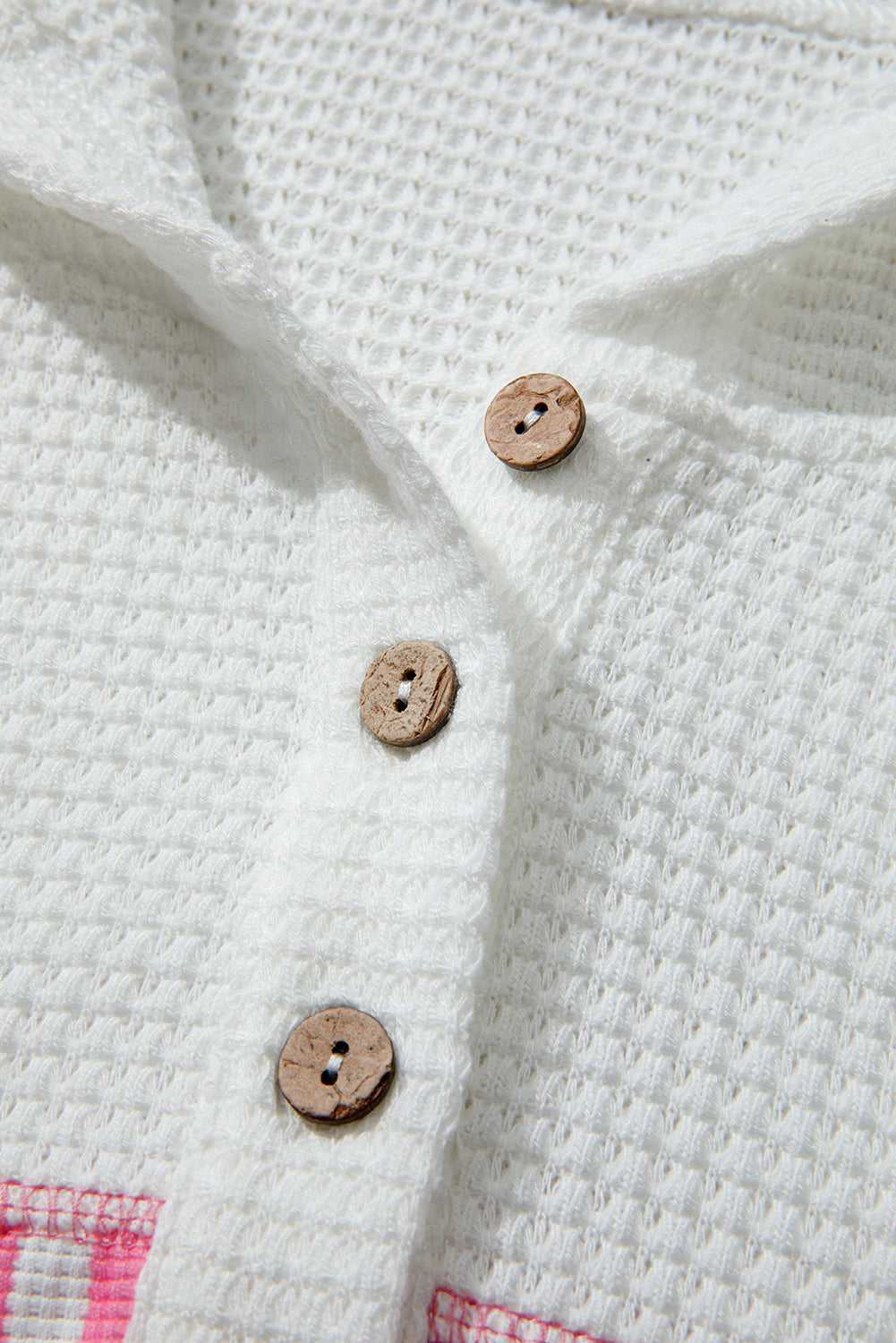 Detail shot of Curve Pink Leopard Stripe Waffle Hoodie for Women showing wooden buttons on soft waffle knit fabric for a rustic casual look.