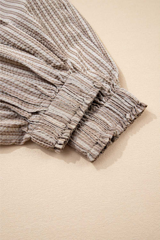 Elastic cuff detail of Women's Brown Stripe Cargo Joggers, emphasizing textured fabric and gathered hem.