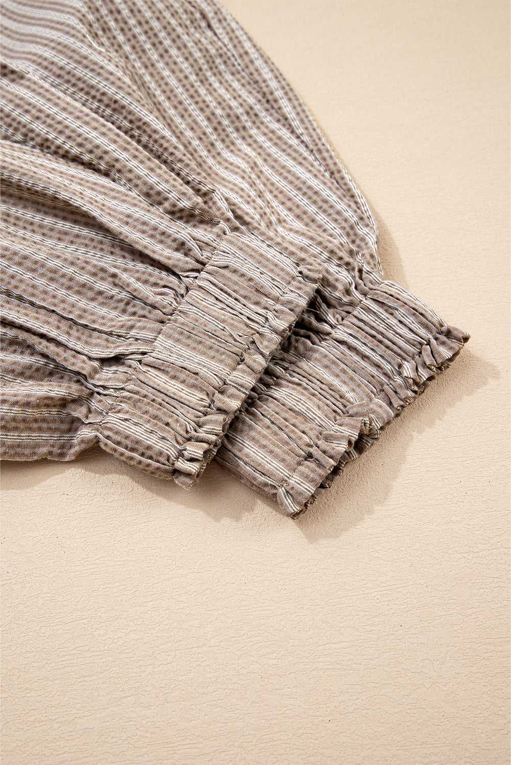 Elastic cuff detail of Women's Brown Stripe Cargo Joggers, emphasizing textured fabric and gathered hem.